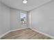 Bright bedroom with new flooring and neutral walls at 1058 Florida Holly Dr, Orlando, FL 32811