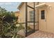 Enclosed back patio with brick pavers and access door at 11537 Blackmoor Dr, Orlando, FL 32837