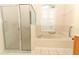 Bathroom featuring a shower and garden tub at 11537 Blackmoor Dr, Orlando, FL 32837