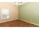 Bright bedroom with wood-look floors and window at 11537 Blackmoor Dr, Orlando, FL 32837