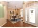 Dining room with wood floors, ceiling fan, and a table with chairs at 11537 Blackmoor Dr, Orlando, FL 32837