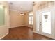 Empty dining room with wood floors, ceiling fan, and large window at 11537 Blackmoor Dr, Orlando, FL 32837