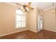 Bright dining room with wood floors, ceiling fan, and window with blinds at 11537 Blackmoor Dr, Orlando, FL 32837