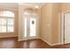 Entryway with wood floors, white door, and decorative window at 11537 Blackmoor Dr, Orlando, FL 32837