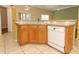 Kitchen island with sink, dishwasher, and cabinets at 11537 Blackmoor Dr, Orlando, FL 32837