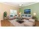 Living Room with beige sofas, coffee table, and area rug at 11537 Blackmoor Dr, Orlando, FL 32837