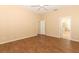 Main bedroom with wood-look floors and en-suite bathroom access at 11537 Blackmoor Dr, Orlando, FL 32837