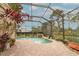 Screened pool and patio area with brick pavers and waterfall at 11537 Blackmoor Dr, Orlando, FL 32837