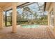 Screened pool area with brick pavers and waterfall feature at 11537 Blackmoor Dr, Orlando, FL 32837