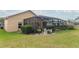 Screened pool and patio area with lush landscaping at 11537 Blackmoor Dr, Orlando, FL 32837