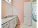 Simple bathroom with single vanity and pink walls at 11769 Hampstead St, Windermere, FL 34786