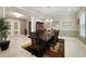 Formal dining room with a large table and chandelier at 11769 Hampstead St, Windermere, FL 34786