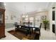 Formal dining room with a large table and chandelier at 11769 Hampstead St, Windermere, FL 34786