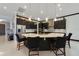 Modern kitchen island with seating and dark cabinetry at 11769 Hampstead St, Windermere, FL 34786