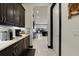 Dark cabinetry and spacious kitchen with butler's pantry at 11769 Hampstead St, Windermere, FL 34786