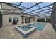 Resort-style pool and spa with covered patio and screened enclosure at 11769 Hampstead St, Windermere, FL 34786