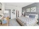 Main bedroom with gray and blue accents and a king bed at 1214 Normandy Dr, Haines City, FL 33844