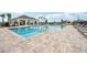 Community pool with a large deck and lounge chairs at 1214 Normandy Dr, Haines City, FL 33844