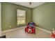 bedroom with green walls, hardwood floors and a Mickey Mouse bed at 1220 Alden Ter, Deltona, FL 32738