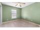 Simple bedroom with light green walls and wood flooring at 1220 Alden Ter, Deltona, FL 32738