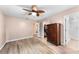 Main bedroom with ceiling fan, wood floor, and walk-in closet at 1220 Alden Ter, Deltona, FL 32738