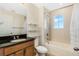 This bathroom features a shower-tub combo with tiled walls and a window at 14190 Dove Hollow Dr, Orlando, FL 32824