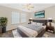 This bedroom features a ceiling fan and natural light at 14190 Dove Hollow Dr, Orlando, FL 32824