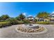 A common area with a water feature, benches, and green shrubs creating a beautiful and serene outdoor space at 14190 Dove Hollow Dr, Orlando, FL 32824