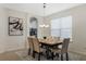 Well-lit dining area featuring a stylish chandelier and modern decor at 14190 Dove Hollow Dr, Orlando, FL 32824