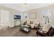 This living room features carpet floors, a sofa, and natural light at 14190 Dove Hollow Dr, Orlando, FL 32824