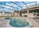 A screened-in pool and patio offers a relaxing oasis, perfect for enjoying sunny days and evening gatherings at 14190 Dove Hollow Dr, Orlando, FL 32824