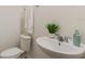 This powder room features a pedestal sink and modern fixtures at 14190 Dove Hollow Dr, Orlando, FL 32824