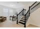 Welcoming foyer with staircase leading to the upper level, and office to the side at 14190 Dove Hollow Dr, Orlando, FL 32824