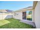 View of backyard with sliding glass door access at 144 Trinity Ridge Cir, Davenport, FL 33897