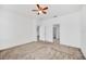 Spacious bedroom with ceiling fan and neutral carpeting at 144 Trinity Ridge Cir, Davenport, FL 33897