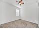 Spacious bedroom with ceiling fan and window at 144 Trinity Ridge Cir, Davenport, FL 33897