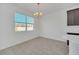 Bright dining room with chandelier and view of backyard at 144 Trinity Ridge Cir, Davenport, FL 33897