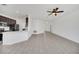 Modern kitchen with dark cabinetry, stainless steel appliances, and expansive white countertops at 144 Trinity Ridge Cir, Davenport, FL 33897