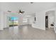 Living room, kitchen, and laundry area with tile floors at 144 Trinity Ridge Cir, Davenport, FL 33897