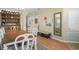 Elegant dining room with a large wooden table and a view of the entry way at 15208 Stonebriar Way, Orlando, FL 32826