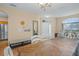 Bright dining room with a large table, seating for 8 and wood floors at 15208 Stonebriar Way, Orlando, FL 32826