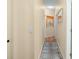 Bright hallway with light walls and wood flooring at 15208 Stonebriar Way, Orlando, FL 32826