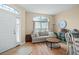 Light and bright living room with a comfy couch and plenty of natural light at 15208 Stonebriar Way, Orlando, FL 32826