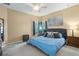 Spacious main bedroom with king-size bed and ensuite bathroom at 15208 Stonebriar Way, Orlando, FL 32826