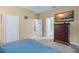 Main bedroom with large dresser and access to en-suite bathroom at 15208 Stonebriar Way, Orlando, FL 32826