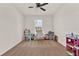 Bright bedroom featuring a ceiling fan and neutral color palette at 1593 Osprey View Dr, Apopka, FL 32703