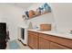 Bright laundry room with built-in cabinets and shelving at 1593 Osprey View Dr, Apopka, FL 32703