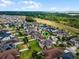 Aerial view of a house's location in a residential neighborhood near water at 1873 Donahue Dr, Ocoee, FL 34761