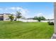 Large backyard with grassy lawn and white vinyl fence at 1873 Donahue Dr, Ocoee, FL 34761