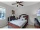 Bedroom with a double bed, dresser, and ceiling fan at 1873 Donahue Dr, Ocoee, FL 34761